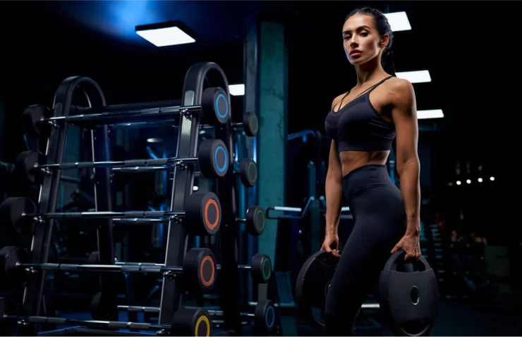 oung woman working out in the gym after recovering knee motion with the ERMI Flexionater, avoiding surgery and regaining strength and mobility