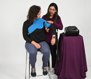 Patient using ERMI Cold Therapy system to manage post-operative pain and swelling
